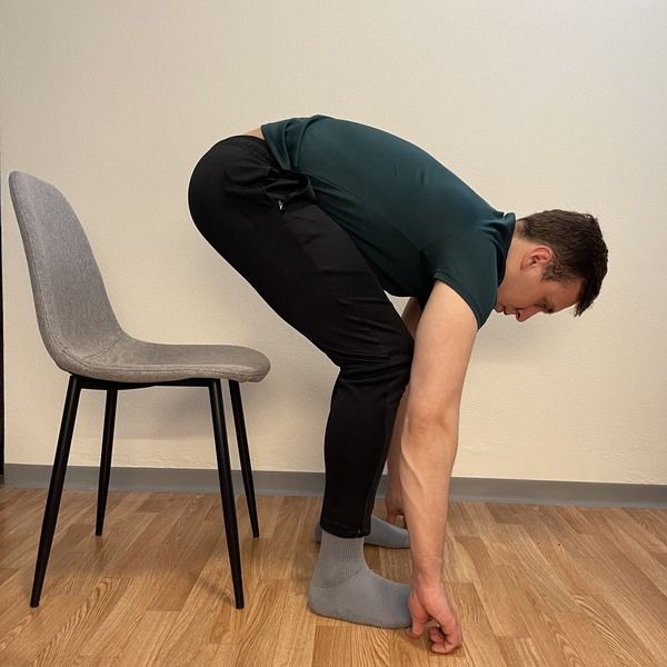 sit to stand touching toes ending position- how to touch your toes