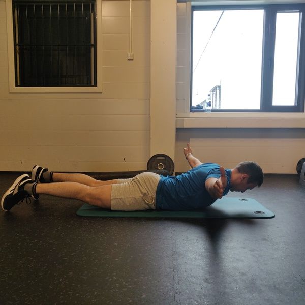 prone arm lift with arms at shoulder height