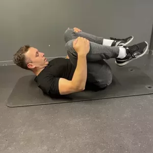 knee to chest erector stretch
