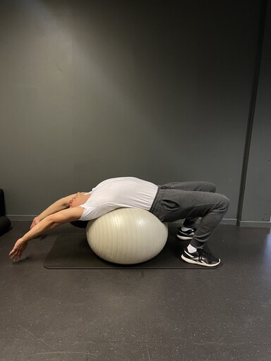 Intermediate yoga ball stretch