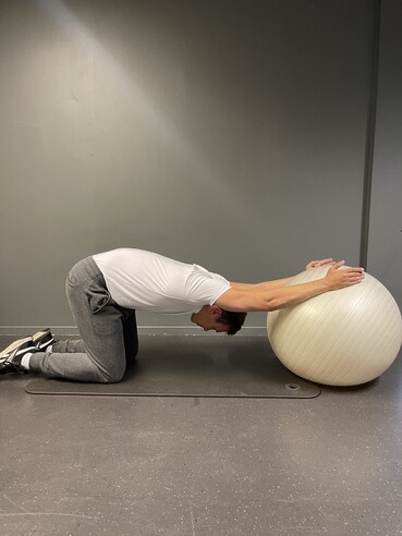 yoga ball lat stretch
