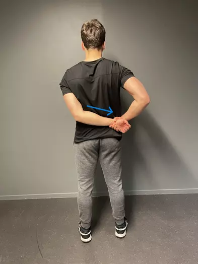 standing arm pull stretch